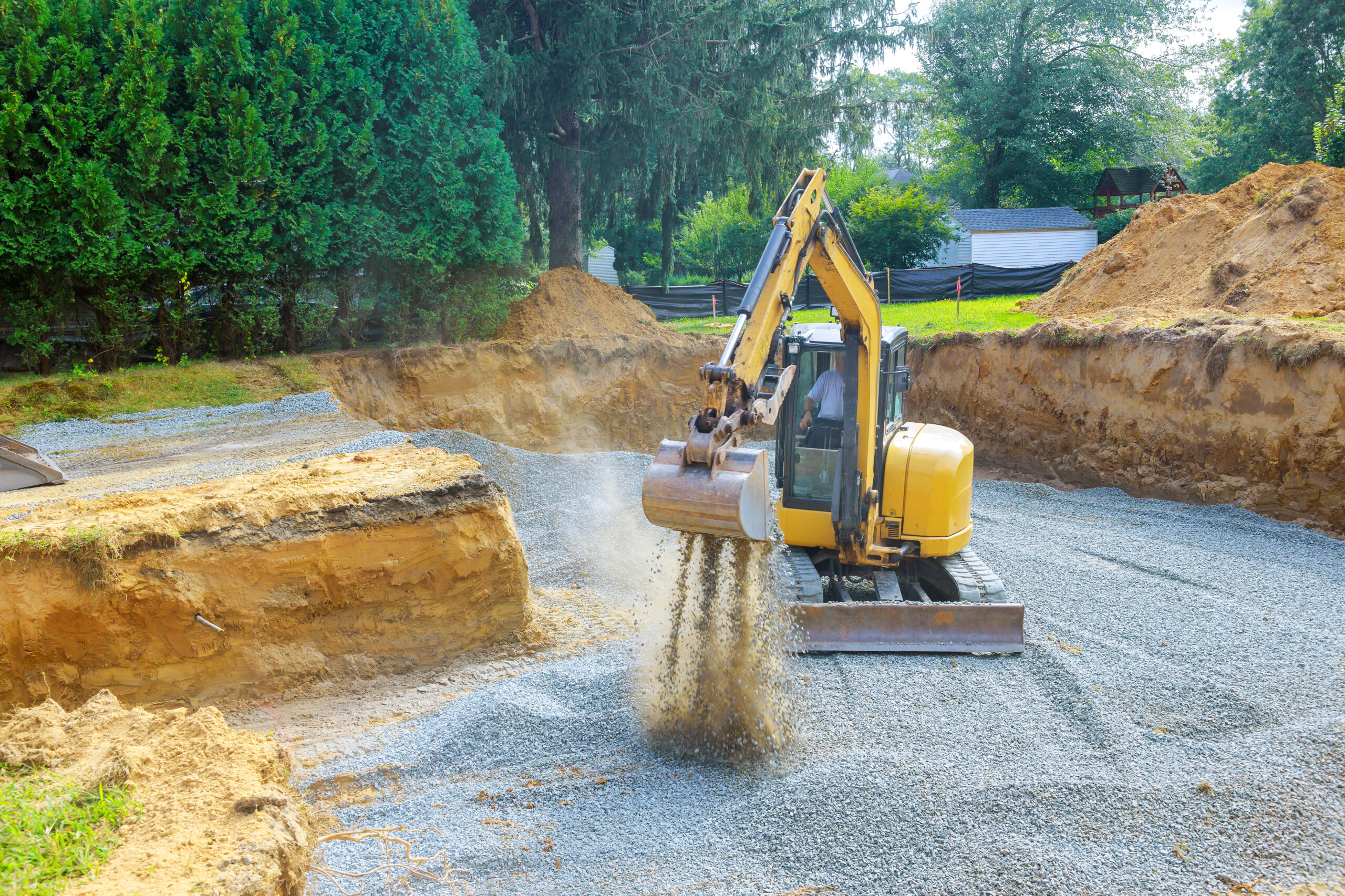 an-excavator-fills-irregularities-in-excavations-w