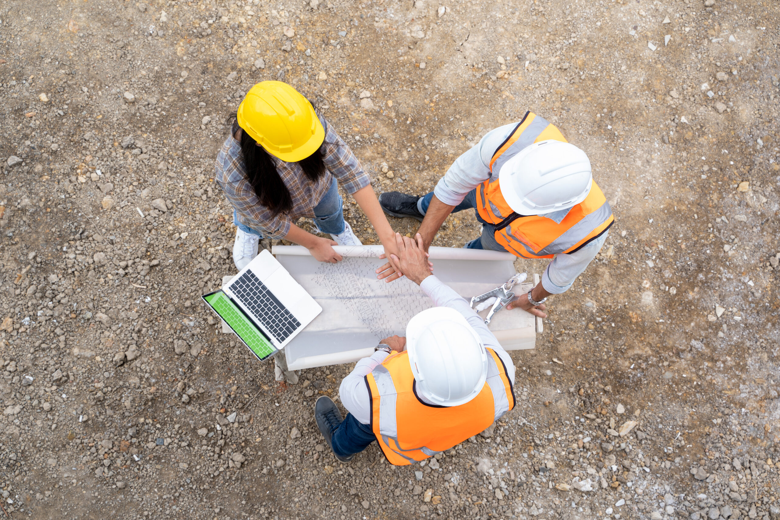Architect,Foreman and worker discussing in building construction site in construction site,Construction residential new house in progress at building site.